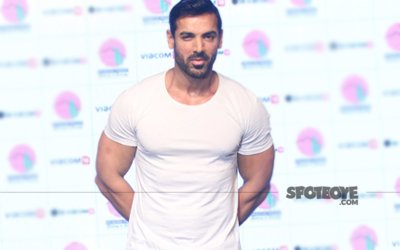 John_Abraham_looking_sexy_in_a_white_body_hugging_tee_at_an_event.jpg