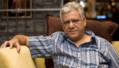 om puri posing for the camera