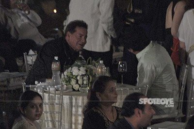 salim khan shares a light moment with a guest at randhir kapoors 70th birthday celebrations