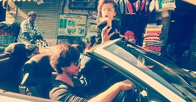 shah rukh khan going for a drive with his son