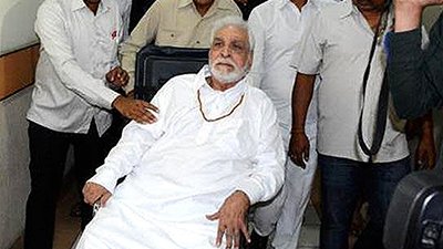 kader khan on a wheelchair