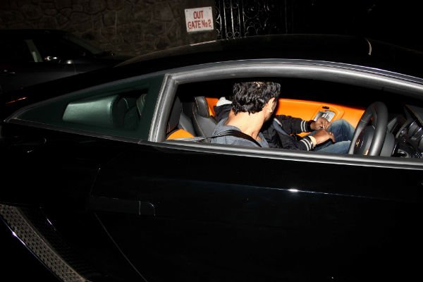 john in his lamborghini outside his bandra office