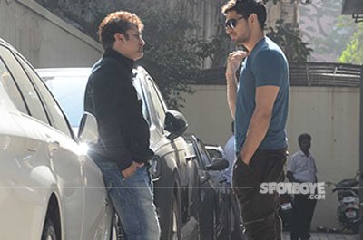 sidharth malhotra and mohit suri having a chat outside vishesh films office