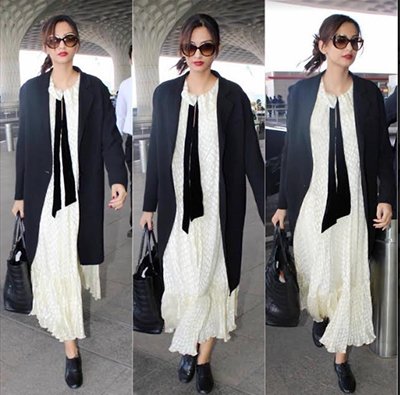 in a long dress with coat and tie by dvf sonam kapoor