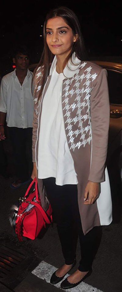 in a houndstooth jacket white top and denims by anand bhushan sonam kapoor