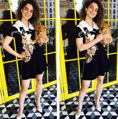 kangana ranaut posing with a puppy