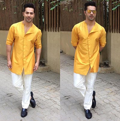 varun dhawan looks dashing in mustard yellow shirt and jeans