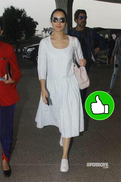 shraddha kapoor looks syunning at the mumbai airport in a white dress 