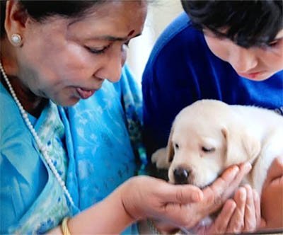 asha with her grandson Ranjai and their pet dog