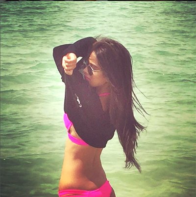 nia sharma looking hot at beachside jumping in the water