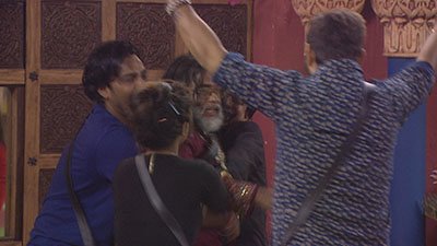 Manu, Navin and Manveer hugging Swamiji.jpg