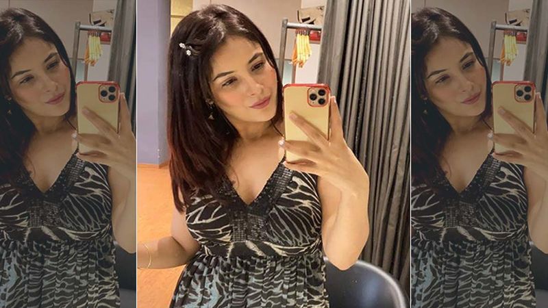 Shehnaaz Gill Shares Some Candids From Canada; Looks Pretty In An Off Shoulder Black Number As She Romances The Camera