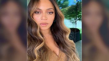 Beyonce Rocks A Sexy Maroon Sweatshirt Bodysuit; Shows Off Her Back Elegantly