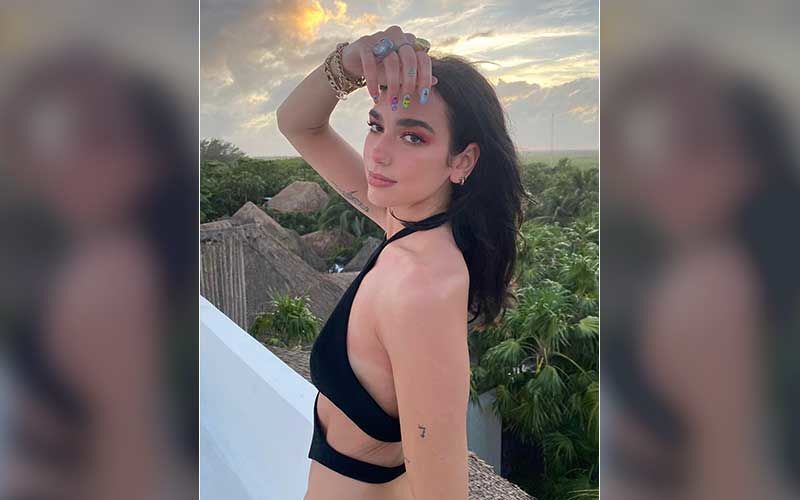 Dua Lipa Flaunts Her SEXY Toned Figure In A Bikini As She Braves Chilly Night On Her All-Girls Vacation!
