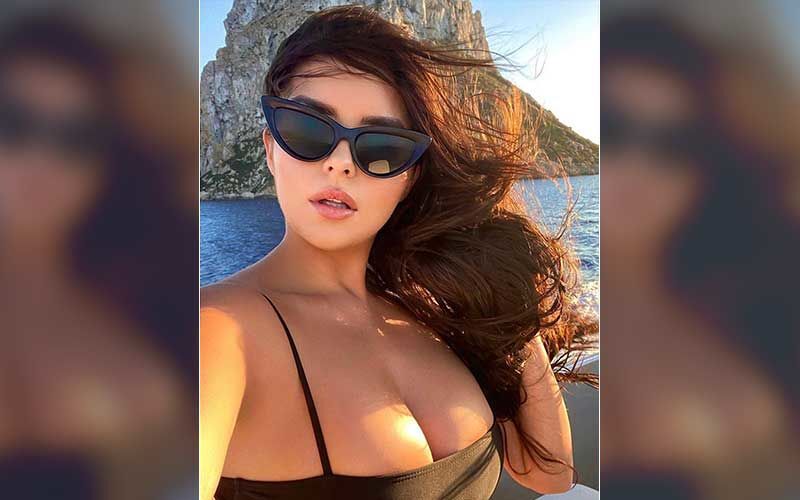 Demi Rose Poses SEMI-NUDE As She Puts Her Eye-popping Ample Assets On Display In Barely-there Top, Fans Call Her ‘Divine Beauty’