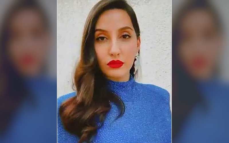 Nora Fatehi Gets Trolled For Her Walk In A Bright Pink Saree Amidst Heavy Mumbai Rains; Netizens Ask, ‘Why is She Walking Like That?’