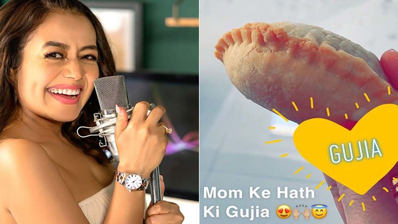 Neha Kakkar Munches On Some Home Made Gujia And Sings Mere Angne Mein Ahead Of Holi 2020-VIDEO