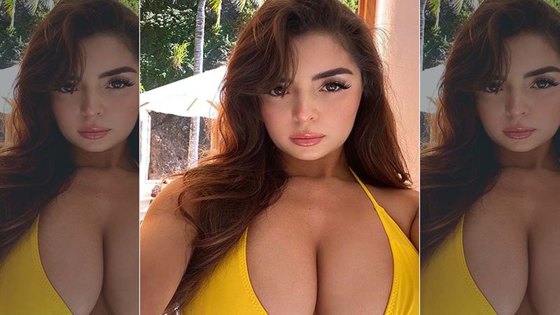 Look Who Is Comfortably Sitting On Demi Rose's Lap As She Gets Ready For A Sexy Shoot