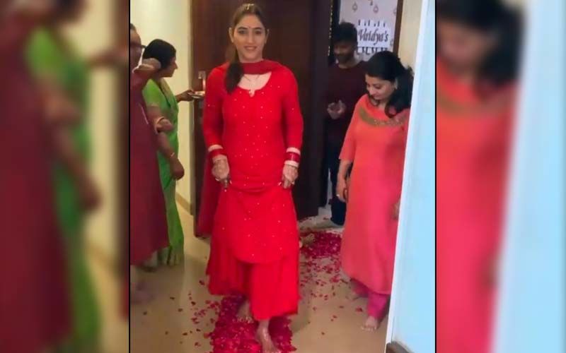 Rahul Vaidya's Wife Disha Parmar Receives A Warm Welcome During Her 'Griha Pravesh' Ceremony; Actress Looks Magnificent In A Red Outfit