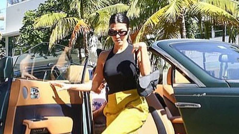 Kourtney Kardashian Leaves Very Little To Imagination In Her Braless Top; But Our Eyes Are On Her Rolls-Royce