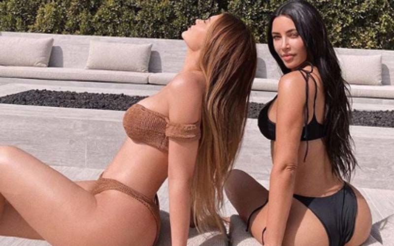Kim Kardashian And Sister Kylie Jenner Get Their Tan On Chilling By The Pool In Yummy Bikinis