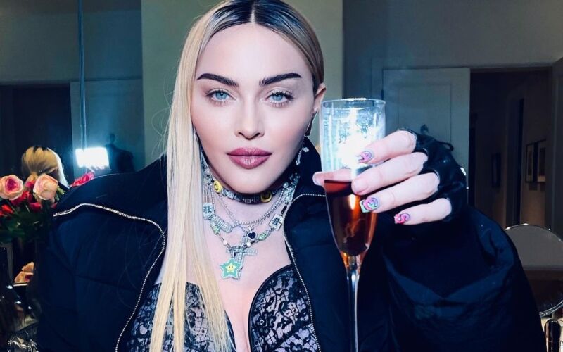 Madonna Covers Up Her Manicure Mishap With A Plunging Lace Top, Singer Flaunts Her Assets With Racy Outfit-PICS INSIDE