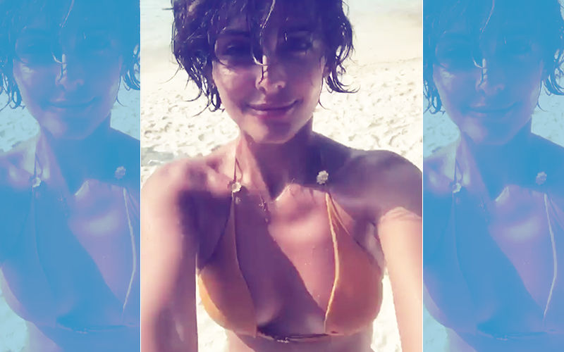 Summer Gets Hotter! Mandana Karimi Sports A Yellow Bikini In Cool Blue Waters