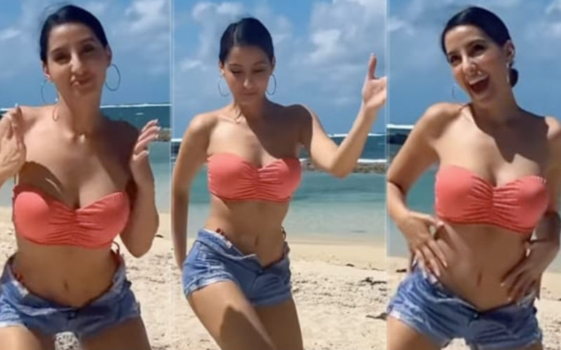VIRAL! Nora Fatehi Dance Moves Set Instagram On Fire; Diva Groves By The Beach In Pink Swim Set And Denim Shorts-WATCH