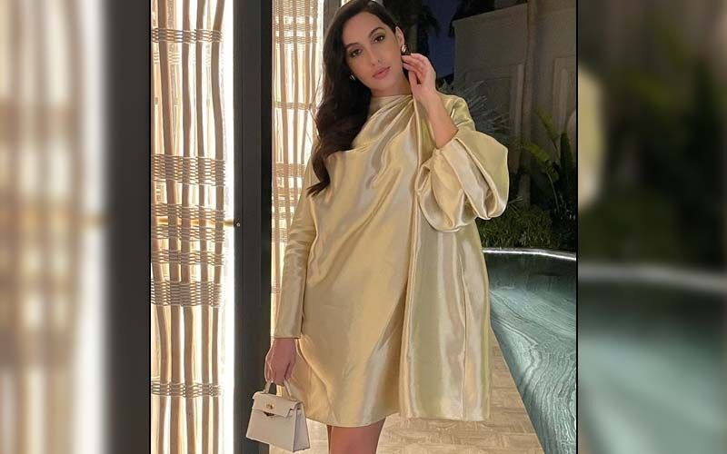 Nora Fatehi Looks Ravishing In A Golden Satin Dress, Gives Glimpse Of Her Birthday Bash With Friends -SEE PICS