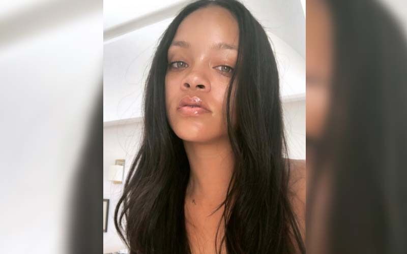 Mommy-To-Be Rihanna Sets New Fashion Goals With Her Appearance At Paris Fashion Week, Flaunts Her Baby Bump In Leather Mini Dress!