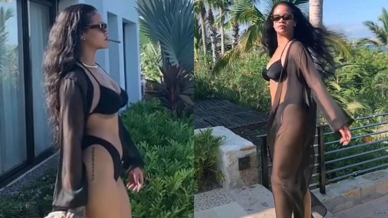 Rihanna Flaunts Her Well Toned Body As She Casually Takes A Stroll In A Sizzling Black Bikini- WATCH VIDEO