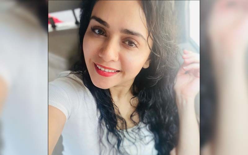 Amruta Khanvilkar Dressed In A Gorgeous Red Anarkali Twirls For The Camera