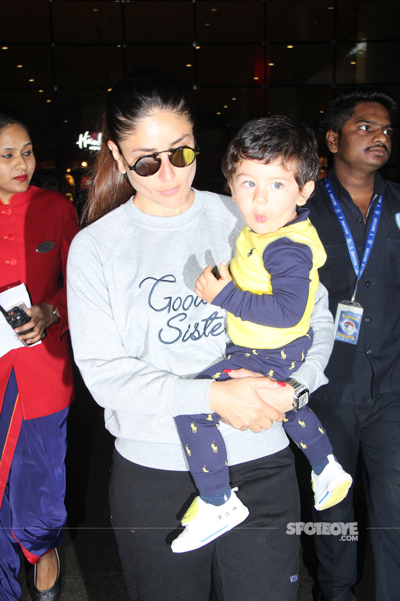 Taimur Smiles At The Shutterbugs As Mommy Kareena Kapoor Carries Him Out Of The Airport