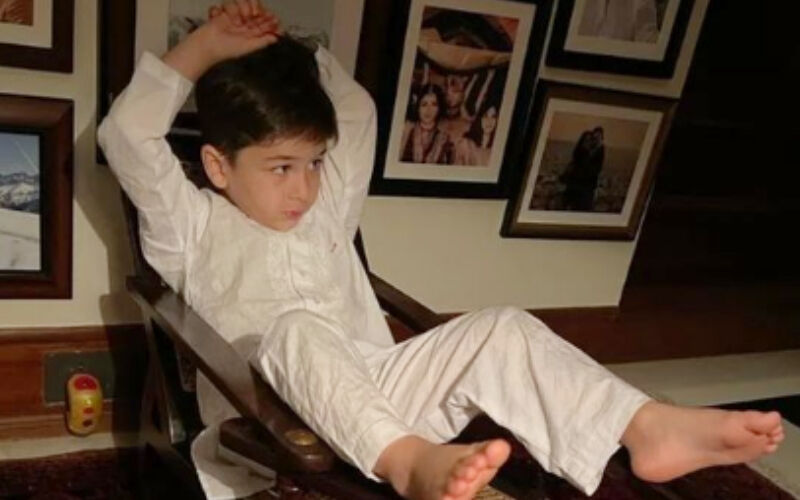 VIRAL! Taimur Ali Khan Chills On An Armchair In A White Kurta Pyjama, Fans Say ‘He Is Looking Like Raj Kapoor’-SEE PHOTO