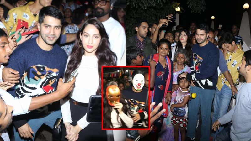 Masked Varun Dhawan Tightly Holds Nora Fatehi's Hand At Mt Mary Church; Actors Invite Crazy Attention, Get Mobbed – VIDEO