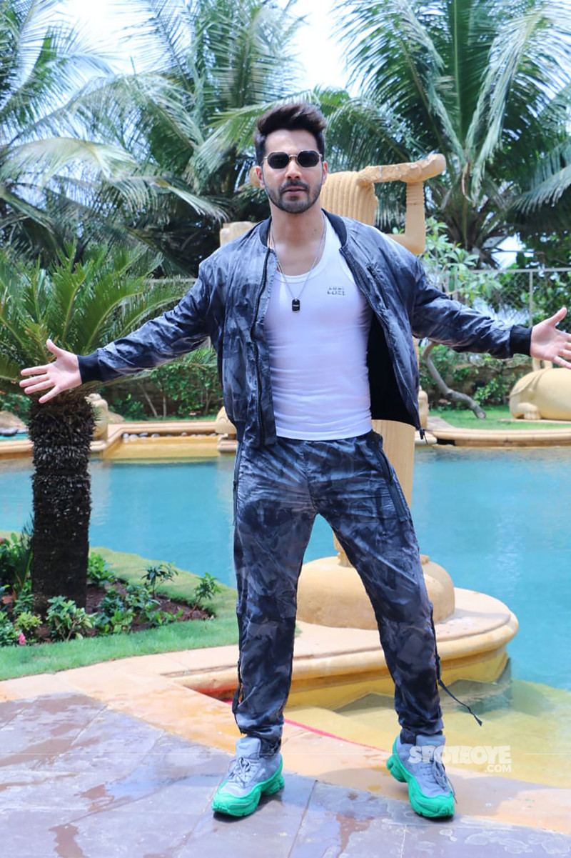 Varun Dhawan Promotes New Range Of Scented Vest In These Pictures Wearing a black tee and a blue jacket with its collar raised, varun sports a mischievous expression in the photo. varun dhawan promotes new range of