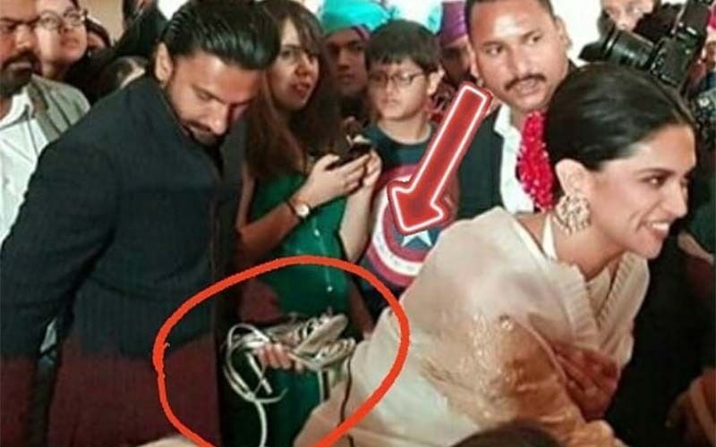 Sweet Hubby Ranveer Singh Carries Deepika Padukone’s Footwear At A Wedding