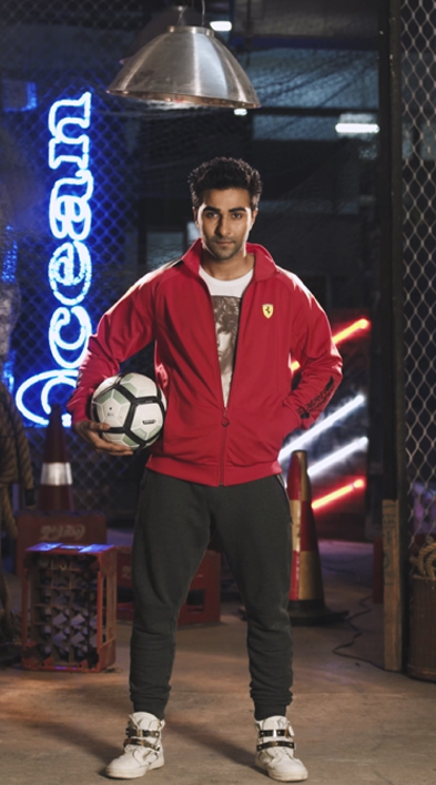 aadar jain posing with a football
