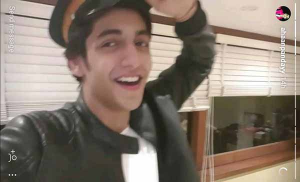 ahaan pandey in a police cap dancing to a song