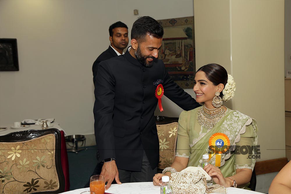 anand ahuja is all ears as sonam kapoor shares a moment with him