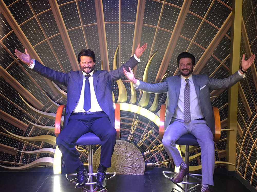 anil kapoor at the madame tussards posing with the statue