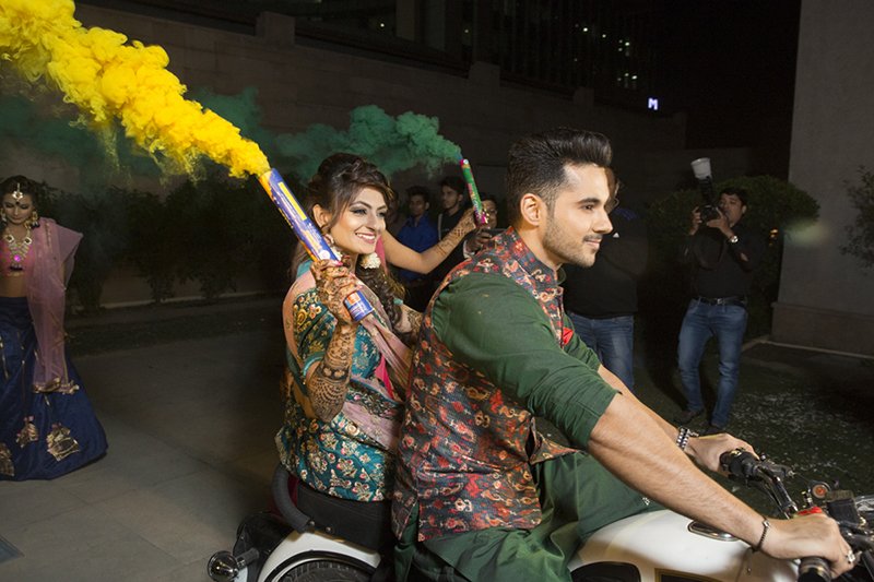 bride and groom arrives on royal enfield