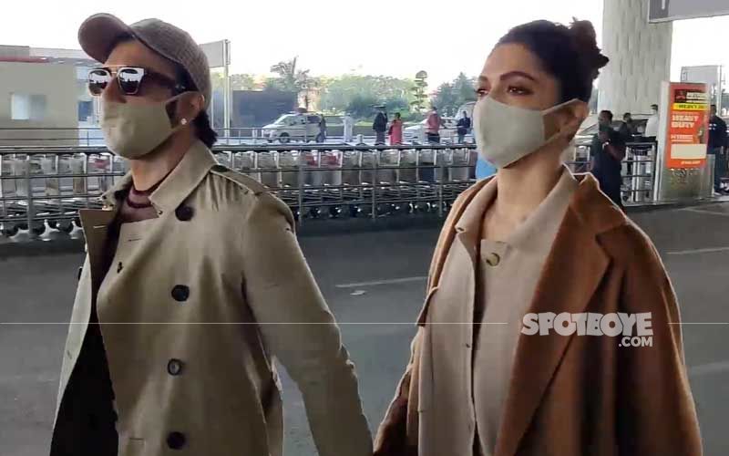Deepika Padukone-Ranveer Singh Dash Off To A Romantic Getaway To Ring In New Year; Get Clicked At Airport Twinning In Trench Coat And Masks