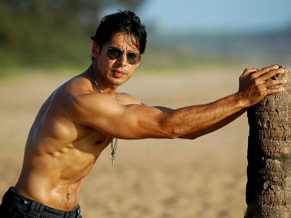 dino morea shows off his muscular body