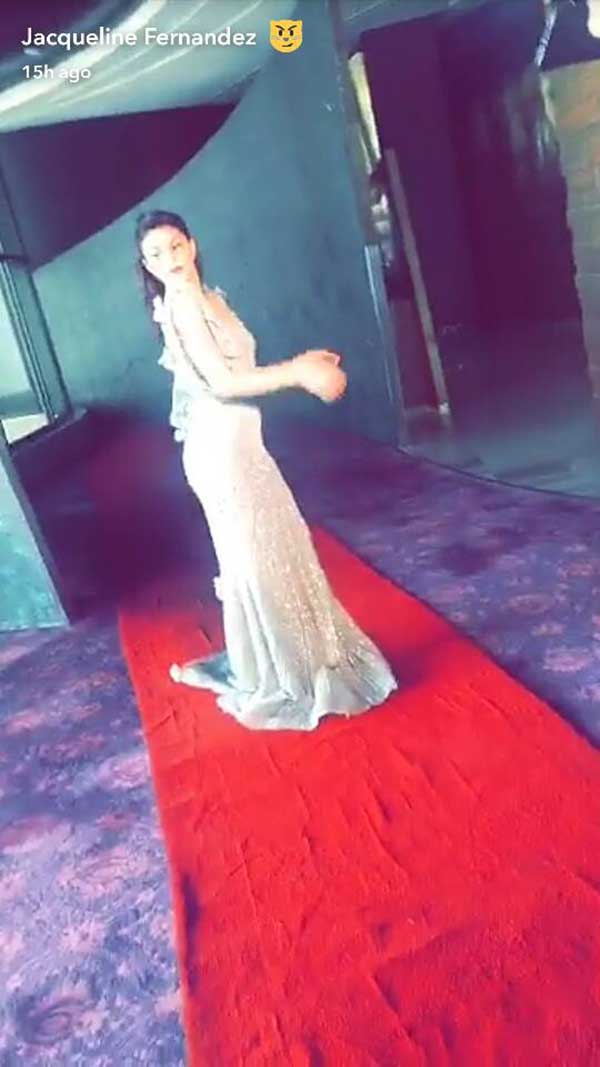 jacqueline fernandez trying on a white gown for justin beiber purpose tour in india