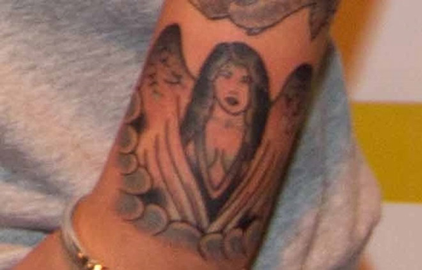 justin bieber angel arm tattoo