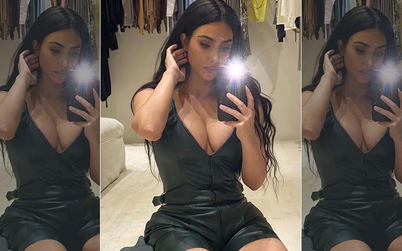 Kim Kardashian Flaunts Her Tiny Waist And Curvaceous Figure In Latex Tiger Pants And Crop Top As She Makes The Most Of The ‘Freezing Season’