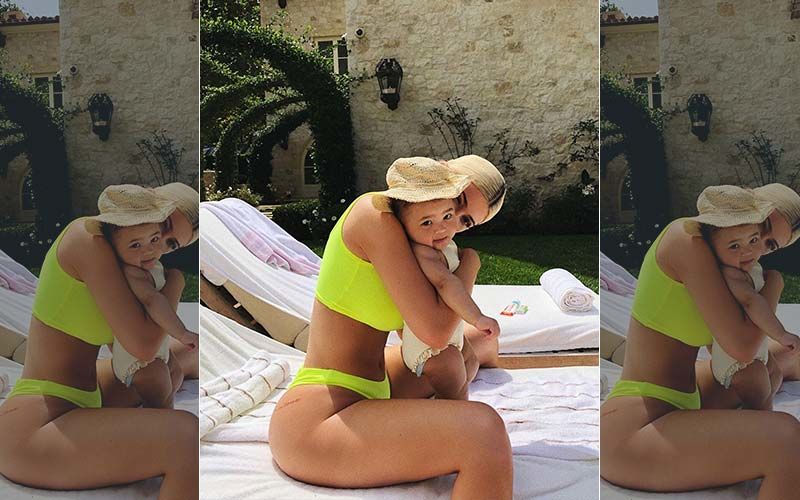 Kylie Jenner's Naughty Neon Bikini Is Unmissable In This Throwback Pic With Daughter Stormi; Travis Scott Must Be Going, 'Damn Gurl'