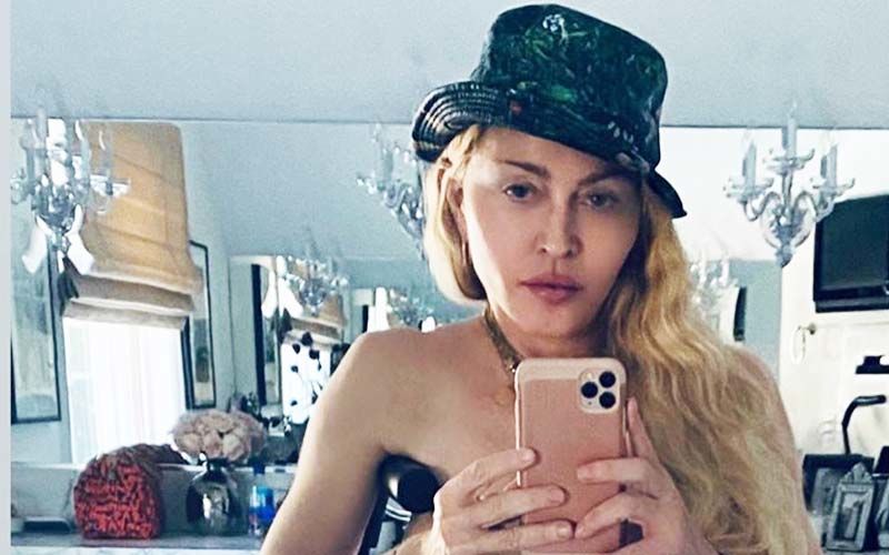Madonna Leans On A Crutch As She Poses Topless For A Sizzling Selfie Months After Her Knee Surgery