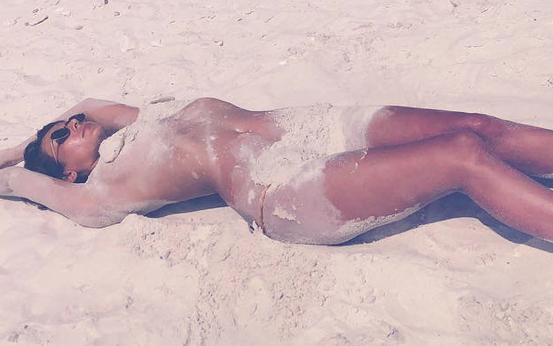 Bold, Bolder, Boldest: Mandana Karimi Poses Topless On A Beach